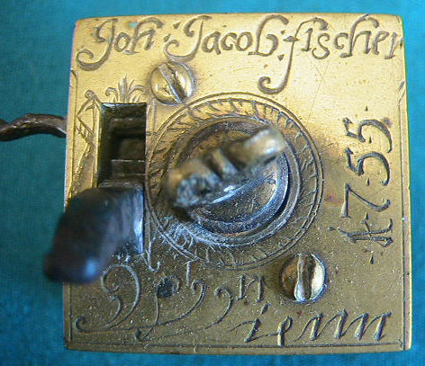 Extremely rare version of a common Viennese (Wien) brass scarificator.  This item is identical in form to the pieces seen elsewhere on the site.  The pieces all have a typical square brass construction with the heart or crown shaped depth screw and 5-6-5 blade configuration.  This piece is unique in its ornate engraving and inscription of "Joh Jacob Fischer in Wien" and the addition of a 1755 date mark.