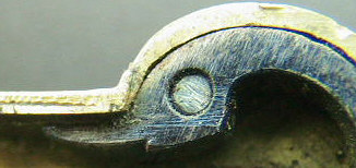 Brass silver spring lancet with ornate engraving marked Andreas Fischer and dated 1790.  Note the similarities to the release bar design and the zoomorhic design of the swan's head finial to the drive spring.  The piece is seen on the page of brass spring lancets.