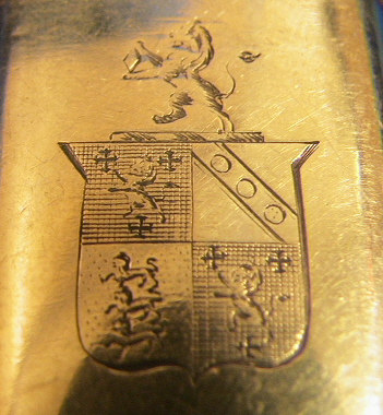 Beautiful gold plated sterling silver lancet case.  The case is marked with a wonderful shield with Lion passants on one side and the initials RCK on the opposite panel.  The 4 toroise shell lancets are marked with either Stodart or a crown and star.  Research is still in process on the family crest.